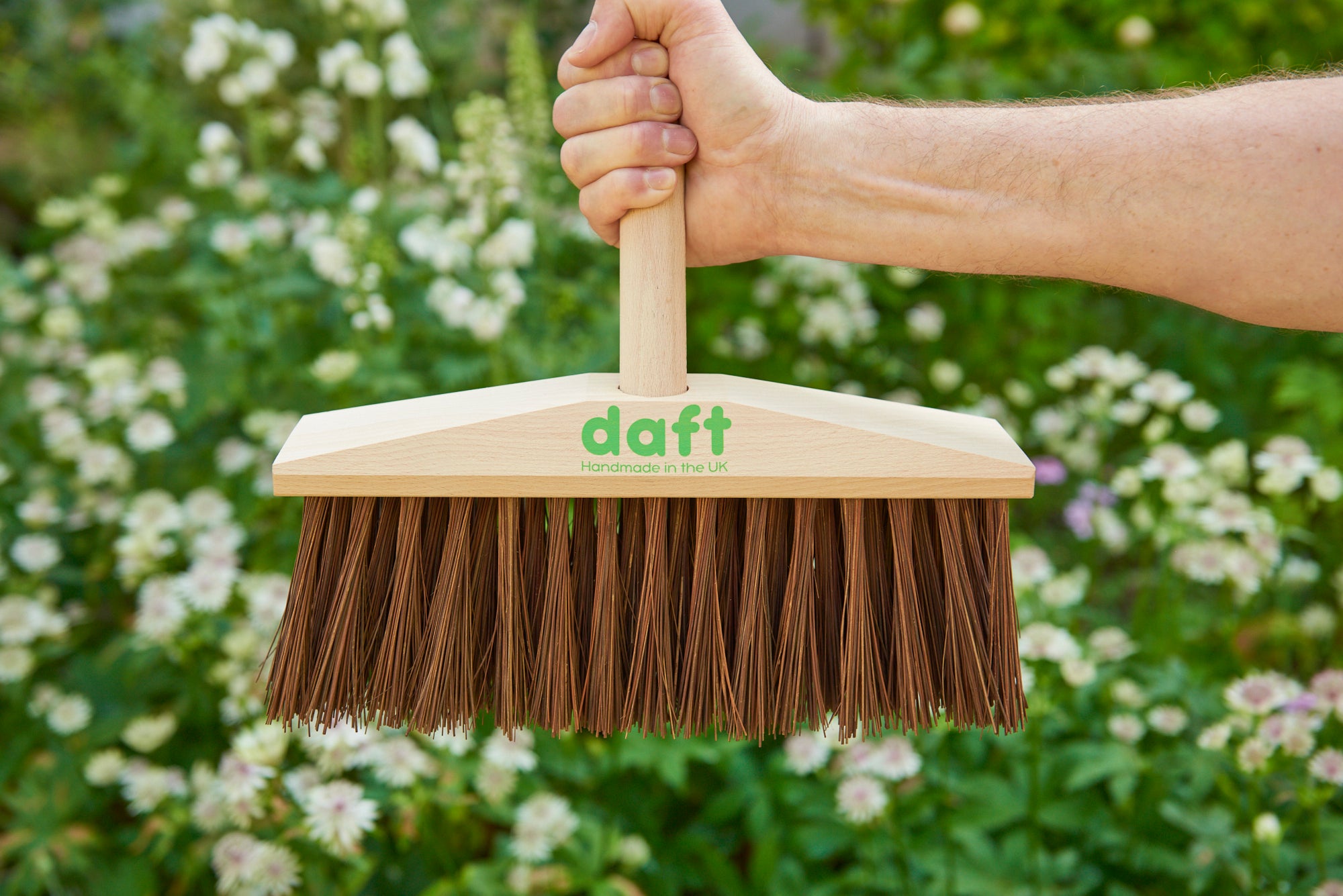 Picture of Daft broom in fist like grip to illustrate its strength